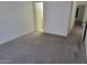 Bedroom with carpet, white walls, and two doorways at 7801 N 44Th Dr # 1036, Glendale, AZ 85301