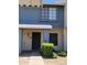 Close-up of charming townhouse entrance with security door and manicured bushes at 7801 N 44Th Dr # 1036, Glendale, AZ 85301