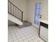 A view of the kitchen floor that leads to the stairs, with access to the front door at 7801 N 44Th Dr # 1036, Glendale, AZ 85301