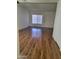 Spacious living room featuring light-filled window and wood-look flooring at 7801 N 44Th Dr # 1036, Glendale, AZ 85301