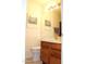 Bathroom featuring a vanity and toilet, with artwork that creates a serene and inviting space at 7977 W Wacker Rd # 196, Peoria, AZ 85381