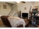Cozy living room with stairs to the second story and an exercise machine at 7977 W Wacker Rd # 196, Peoria, AZ 85381