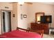 Well-lit main bedroom offering a dresser, TV, and neutral-toned walls, creating a peaceful atmosphere at 7977 W Wacker Rd # 196, Peoria, AZ 85381