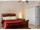 Comfortable main bedroom featuring a wooden bed frame and closet space, providing ample storage at 7977 W Wacker Rd # 196, Peoria, AZ 85381