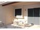 Cozy outdoor patio with table and chairs with sliding door access at 7977 W Wacker Rd # 196, Peoria, AZ 85381