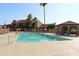 Community pool area featuring inviting clear water, a covered pavilion, and well-maintained grounds at 7977 W Wacker Rd # 196, Peoria, AZ 85381