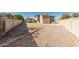 Expansive backyard featuring a shed, ramada, and desert landscaping at 840 N Acacia --, Mesa, AZ 85213