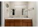 Bathroom featuring double sinks and vanities, mirrors, and beige tiled floors at 840 N Acacia --, Mesa, AZ 85213