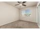 Bedroom with tan walls, carpet flooring, and large window for natural light at 840 N Acacia --, Mesa, AZ 85213