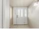 Bright entryway featuring tile flooring and a decorative glass front door with sidelights at 840 N Acacia --, Mesa, AZ 85213