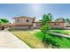 Traditional two-story home featuring a well-manicured lawn and mature landscaping at 840 N Acacia --, Mesa, AZ 85213