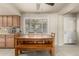 Eat-in kitchen features updated flooring and cabinets, great natural light, and a back door for easy access to the backyard at 840 N Acacia --, Mesa, AZ 85213