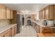 Traditional kitchen featuring stainless steel appliances, modern fixtures, and tile flooring at 840 N Acacia --, Mesa, AZ 85213