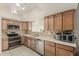 Bright kitchen featuring tile floors, stainless steel appliances, and modern fixtures at 840 N Acacia --, Mesa, AZ 85213