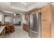 Eat in kitchen featuring stainless steel appliances, quartz countertops and tile flooring at 840 N Acacia --, Mesa, AZ 85213