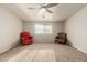 Bonus living area featuring neutral walls and carpet, lots of natural light, and two comfortable armchairs to relax in at 840 N Acacia --, Mesa, AZ 85213