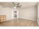 Large room featuring light walls, hard surface floors, and a ceiling fan at 840 N Acacia --, Mesa, AZ 85213