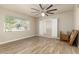 Spacious living room featuring hard surface floors, a ceiling fan, and light walls at 840 N Acacia --, Mesa, AZ 85213