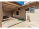 Covered patio with a window, water hose, and door at 840 N Acacia --, Mesa, AZ 85213