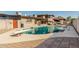 Enjoy this backyard pool with diving board, ramada, and ample space for outdoor gatherings and relaxation at 840 N Acacia --, Mesa, AZ 85213