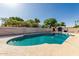 Backyard pool and deck area surrounded by a block fence at 840 N Acacia --, Mesa, AZ 85213
