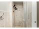 Shower with tiled walls and shower caddy at 840 N Acacia --, Mesa, AZ 85213