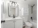 Bathroom featuring white vanity, shower, and updated finishes at 845 E Hampton Ave, Mesa, AZ 85204