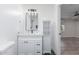 Stylish bathroom with modern vanity, mirror, and tiled shower at 845 E Hampton Ave, Mesa, AZ 85204