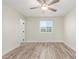 Bright bedroom features wood-look floors and ceiling fan at 845 E Hampton Ave, Mesa, AZ 85204