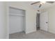 Bedroom with carpet, a ceiling fan and closet with sliding mirror doors at 845 E Hampton Ave, Mesa, AZ 85204