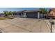 Charming single story home featuring a spacious driveway and a covered parking space at 845 E Hampton Ave, Mesa, AZ 85204