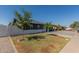 Charming single story home featuring a spacious front yard with two trees at 845 E Hampton Ave, Mesa, AZ 85204