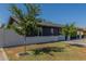 Charming single story home featuring a spacious front yard with two trees at 845 E Hampton Ave, Mesa, AZ 85204