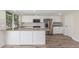 Stylish kitchen with breakfast bar, stainless appliances, and granite counters at 845 E Hampton Ave, Mesa, AZ 85204