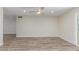 Bright, open living room with wood floors, ceiling fan and neutral paint at 845 E Hampton Ave, Mesa, AZ 85204