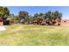 Spacious community lawn with mature trees and manicured grounds creates a relaxing and picturesque environment at 8940 W Olive Ave # 59, Peoria, AZ 85345
