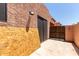 Exterior showing side yard under construction with fencing and stucco walls at 8940 W Olive Ave # 59, Peoria, AZ 85345