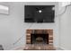 Close up of a classic brick fireplace, providing a warm focal point for the living area at 8940 W Olive Ave # 59, Peoria, AZ 85345