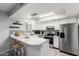 Well-lit kitchen features stainless steel appliances, a breakfast bar, and ample counter space for cooking at 8940 W Olive Ave # 59, Peoria, AZ 85345