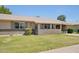 Lovely single-story house with a well-kept lawn and inviting covered porch area at 10431 W Roundelay Cir, Sun City, AZ 85351