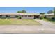 Charming single-story home featuring a well-manicured lawn and a covered entryway at 10431 W Roundelay Cir, Sun City, AZ 85351