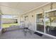 Inviting screened lanai with patio chairs, perfect for relaxing and enjoying the outdoor space at 10431 W Roundelay Cir, Sun City, AZ 85351