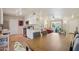 Open living space combines kitchen, dining, and sitting areas for modern living at 10431 W Roundelay Cir, Sun City, AZ 85351