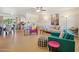 Open-concept living area with an eclectic mix of furniture and decor at 10431 W Roundelay Cir, Sun City, AZ 85351