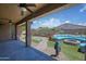 Stunning backyard oasis featuring a cozy lounge area with a fire pit and lush landscaping at 1101 W Oleander Ave, Queen Creek, AZ 85140