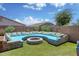 Backyard featuring desert landscaping with custom outdoor seating area around a fire pit at 1101 W Oleander Ave, Queen Creek, AZ 85140