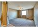 Bright, carpeted bedroom with a ceiling fan and curtains, offering a comfortable and relaxing space at 1101 W Oleander Ave, Queen Creek, AZ 85140
