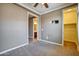 Bedroom with ceiling fan, wall mounted television hook ups, doorway, and a walk in closet at 1101 W Oleander Ave, Queen Creek, AZ 85140