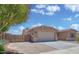 Charming single-story home with desert landscaping and a two-car garage, set against a beautiful blue sky at 1101 W Oleander Ave, Queen Creek, AZ 85140