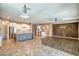 Spacious living room with an open-concept kitchen, modern appliances, and hardwood floors at 1101 W Oleander Ave, Queen Creek, AZ 85140